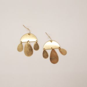worn gold crescent and teardrop earrings