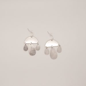 worn silver crescent and teardrop earrings